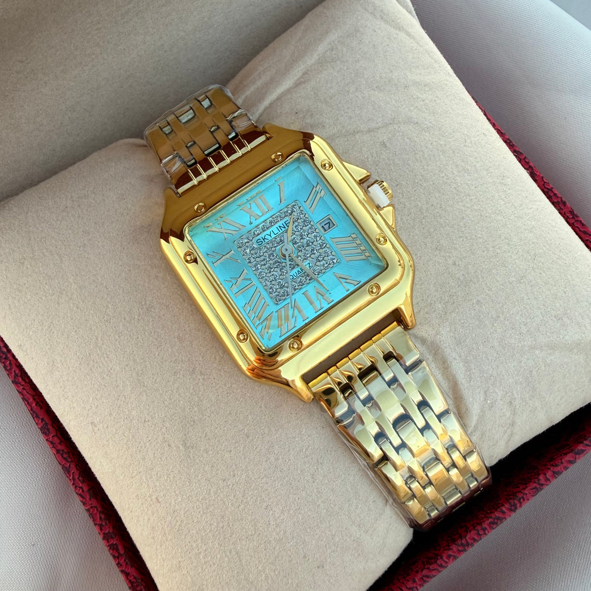 Reloj Carti dorado celeste